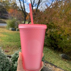 Starbucks cup. Pink